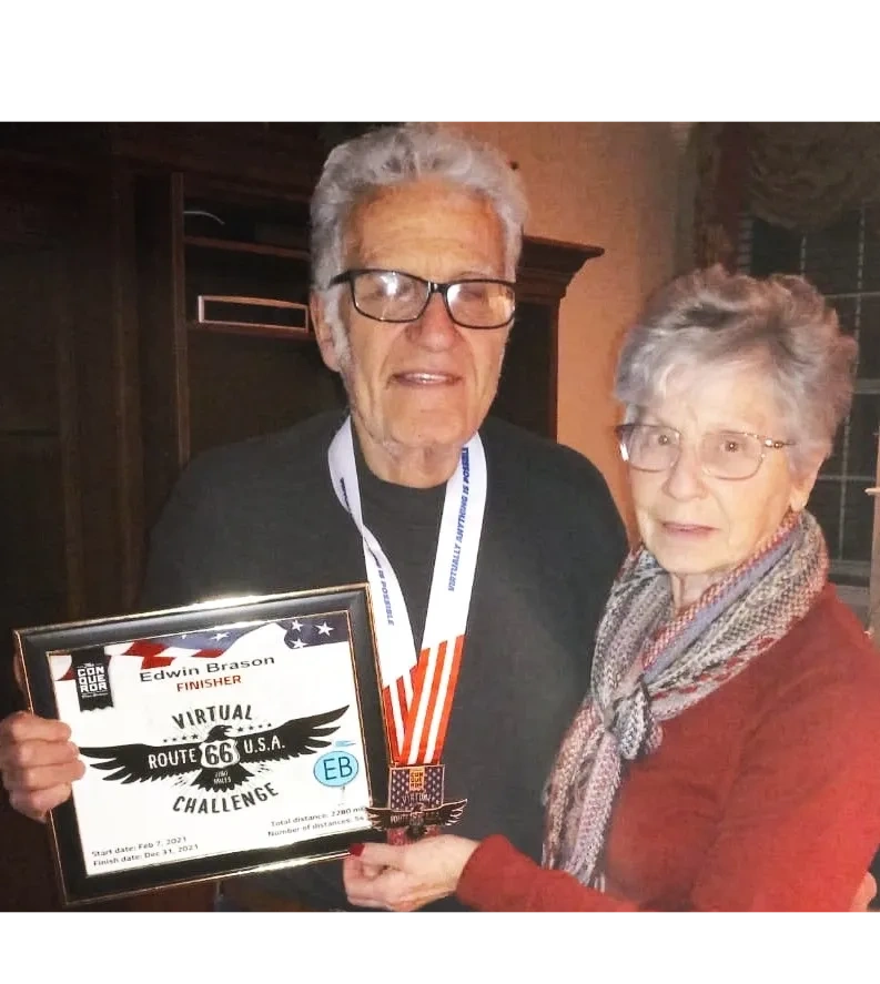 Ed and Marsha Brason celebrating his achievement of walking 1,000 miles in one year