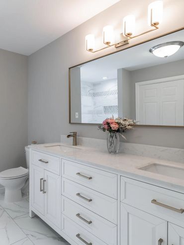 White vanity and gold mirror 