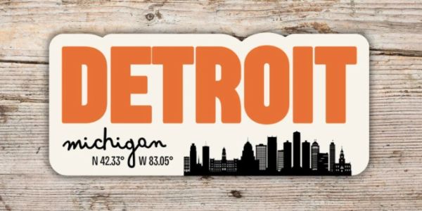 Detroit Michigan sign with city skyline and coordinates.