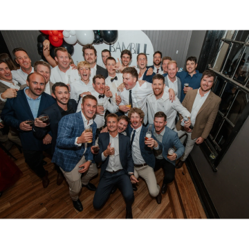 Group of men celebrating at a party.