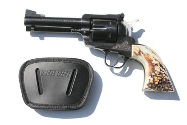 The XL holds semi-automatics with a light or laser attachment.  It will hold a Smith and Wesson 500 