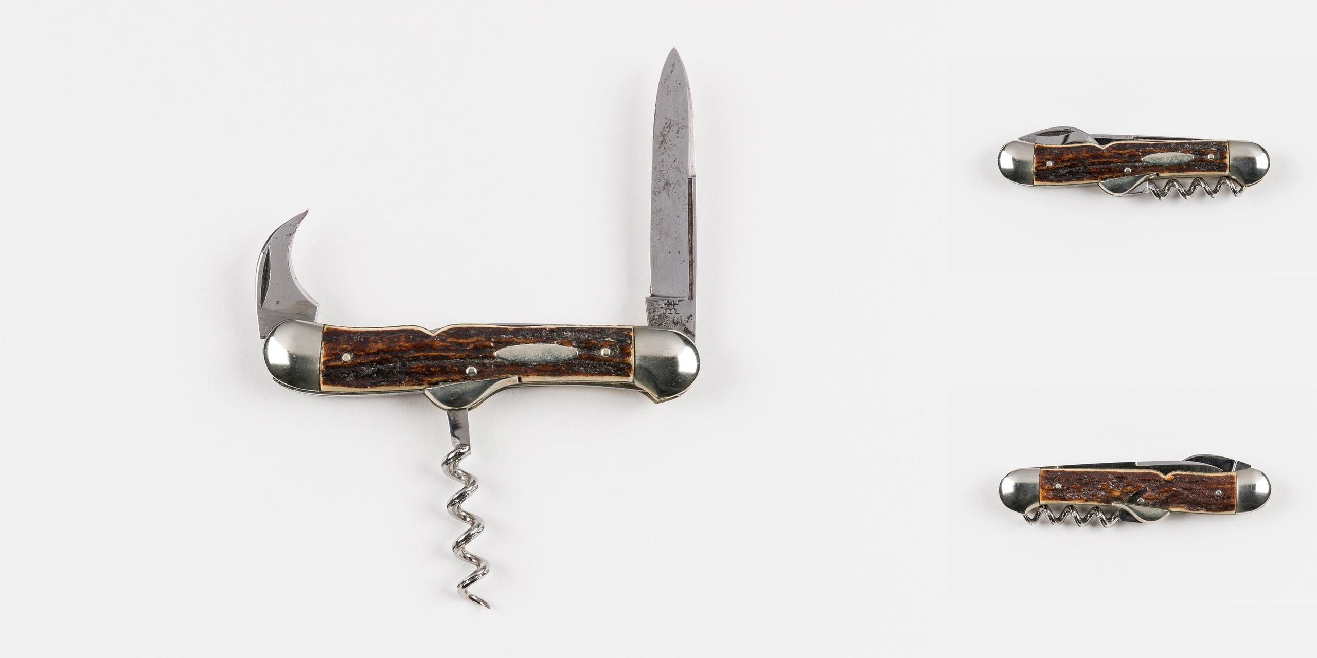 Vintage multi-tool pocket knives with wooden handles and metal blades.