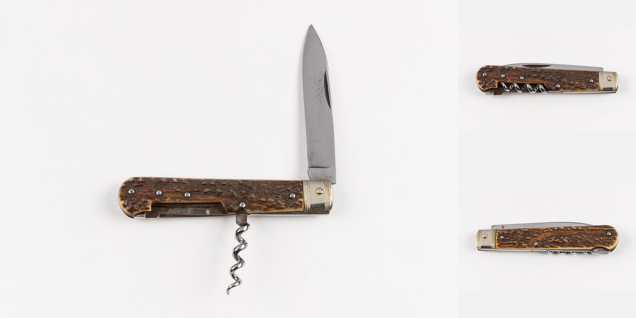 Vintage folding pocket knife with a corkscrew and textured wooden handle.