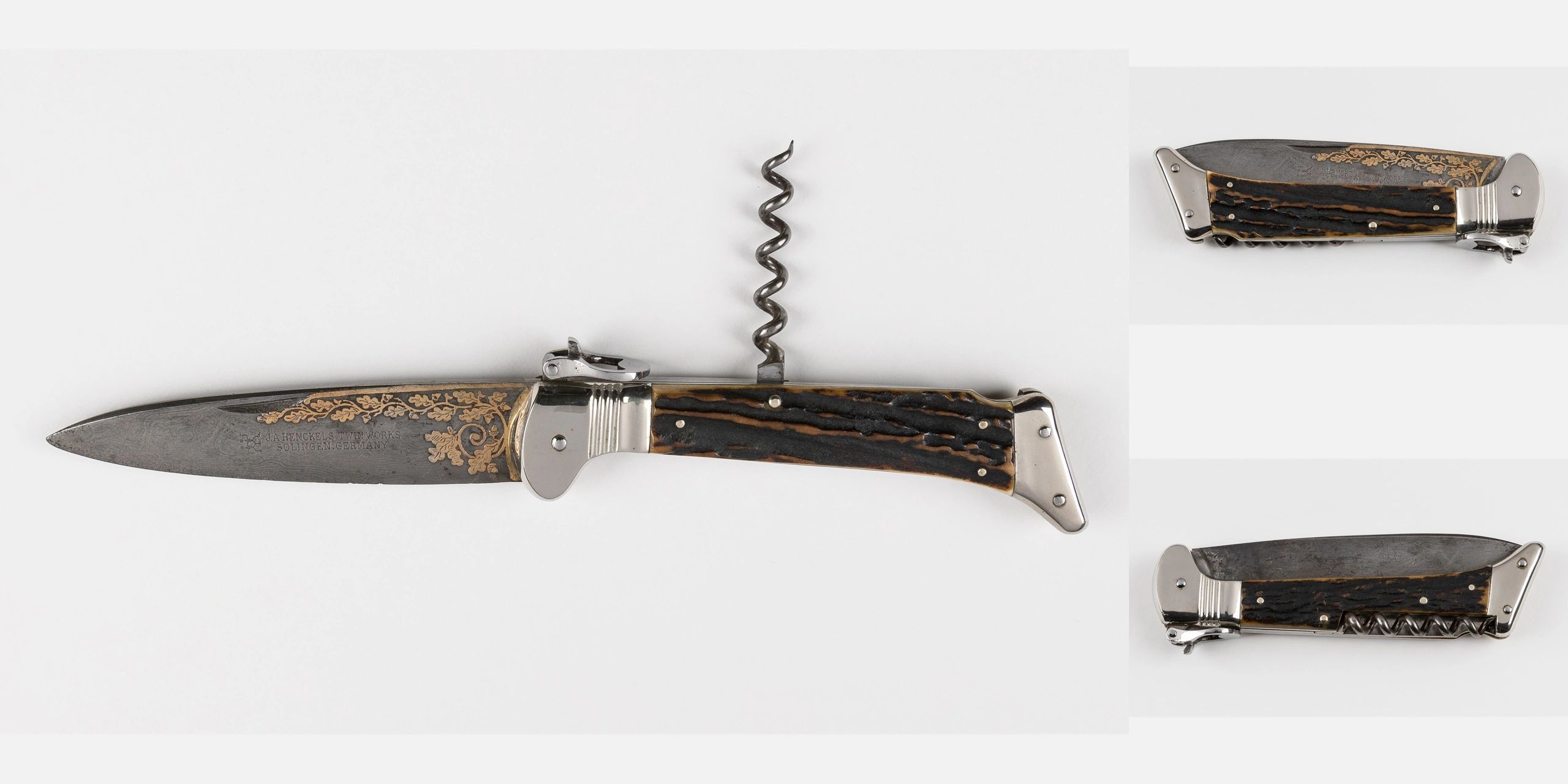 Vintage multifunctional folding knife with a corkscrew and engraved blade.