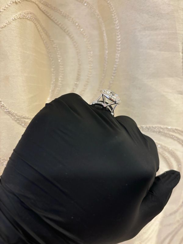 Elegant Bella Andrea & Co. large CVD IGI graded  diamond ring held by a gloved hand.