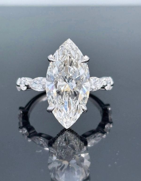 Bella Andrea & Co designed large diamond  lab grown CVD Marquise-cut diamond ring with side stones.