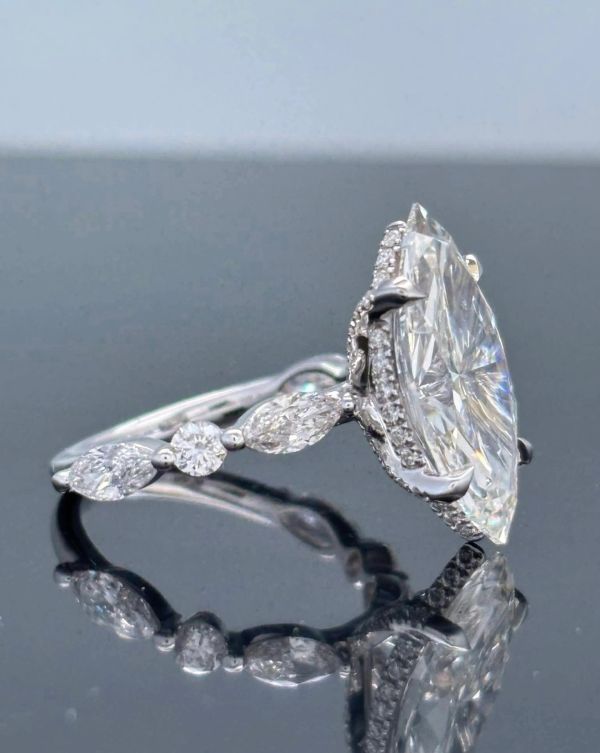 Elegant Bella Andrea & Co. diamond ring with marquise and round stones.