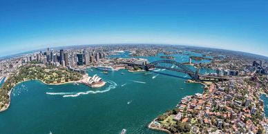 Aerial view of Sydney Harbour with Opera House and Harbour Bridge.