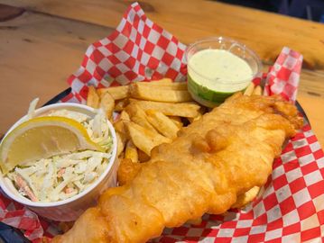 Fried halibut fish with french fries and coleslaw