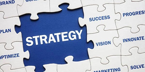 A puzzle with the word STRATEGY at the center surrounded by related business terms.