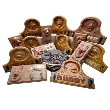 Wood-carved dog name plaques with leash hooks.