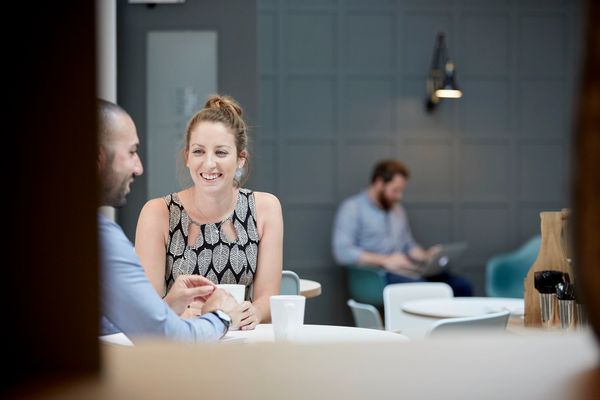 People drinking coffee in a coworking area