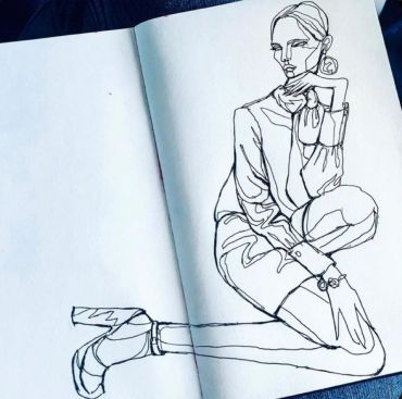 A minimalist continuous line drawing of a stylish woman seated.