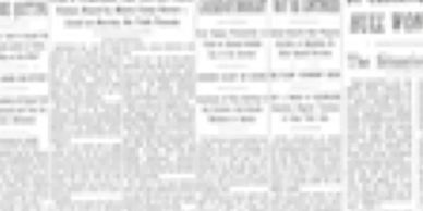 A blurred newspaper page with multiple columns of text and headlines.