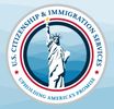 Seal of U.S. Citizenship and Immigration Services with Statue of Liberty.