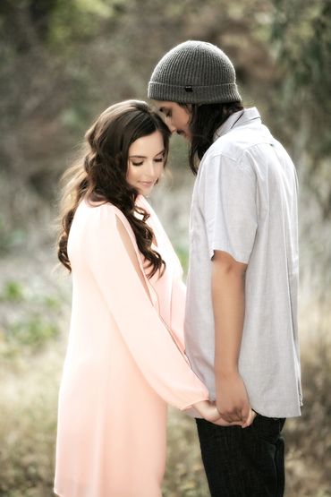 Romantic photo of a couple in love holding hands in a sweet embrace.