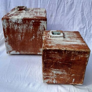 two ceramic square-shaped vases 