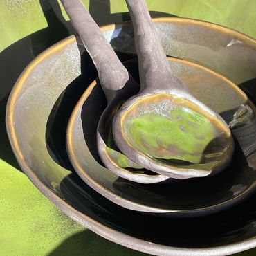 ceramics bowls and spoons in a lime green glaze