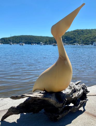 Wood sculpture of pelican