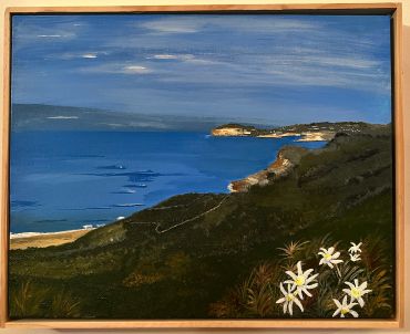 Coastal landscape with sea and flowers.