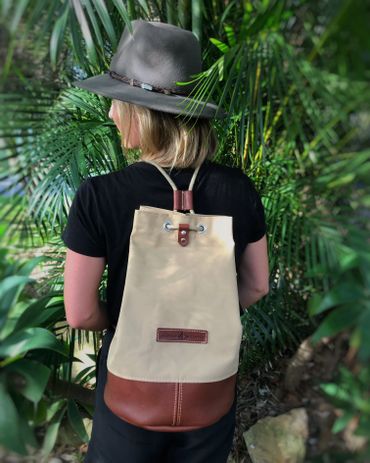 canvas and leather bag on a girl's back