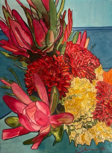 Bright red and yellow flowers in a blue setting.