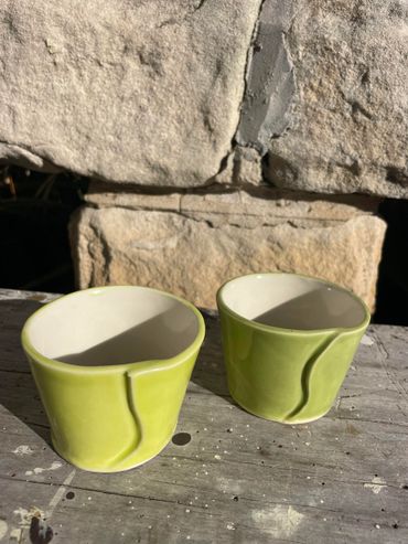 two lime green ceramic cups