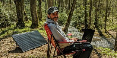 Hutch working from the road, taking advantage of solar power, Cherokee National Forest, April 2020.