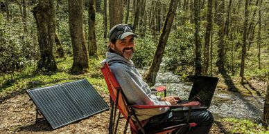 Hutch working from the road, taking advantage of solar power, Cherokee National Forest, April 2020.