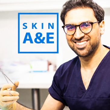 Smiling male doctor in scrubs with Skin A&amp;E logo.