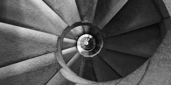 black and white photo of a spiral staircase