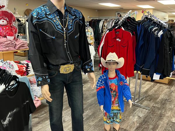 Two male idols wearing cowboy dress at a shop