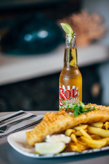 Plated fish and chips with beer