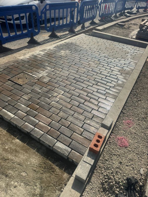 Newly laid brick pavement at a construction site.