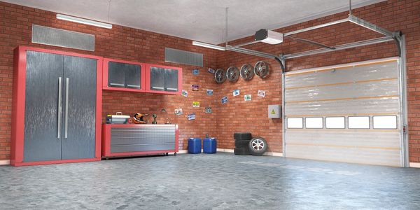 Super clean garage interior with brick walls, epoxy floor and cabinets.