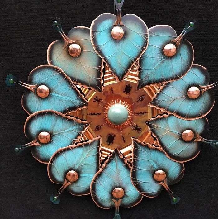 Original and unique Decorative circular art with patinaed copper aspen leaves.