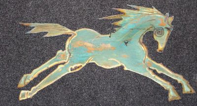 Artistic horse cutout with a distressed turquoise finish.