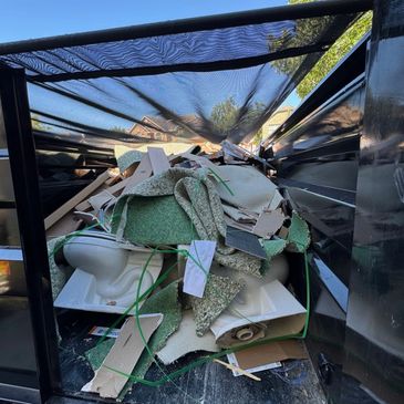 dump trailer full of construction debris hauled away by Yellowstone junk removal
