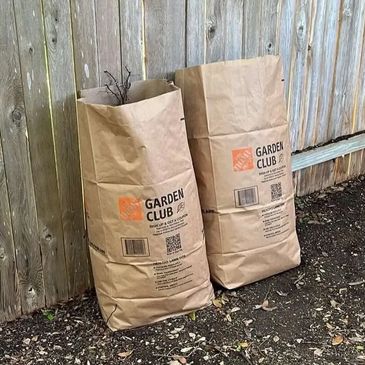 Piles of yard debris ready for pickup by Yellowstone Junk Removal.