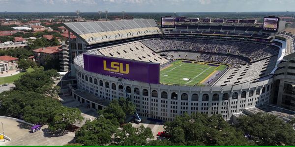 Aerial view of LSU's Tiger Stadium with a partly filled crowd.