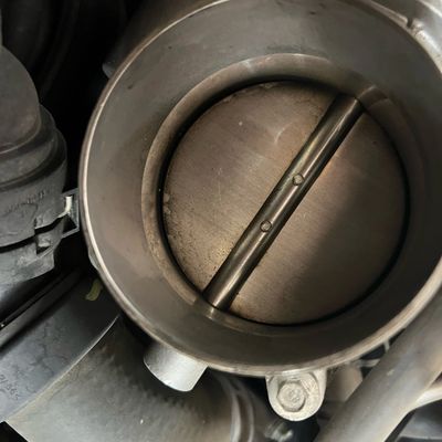 Dirty Throttle Plate on a Direct Injection motor that decreases Air flow and Fuel Economy