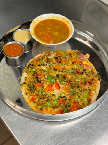 Vibrant vegetarian thali with dal,