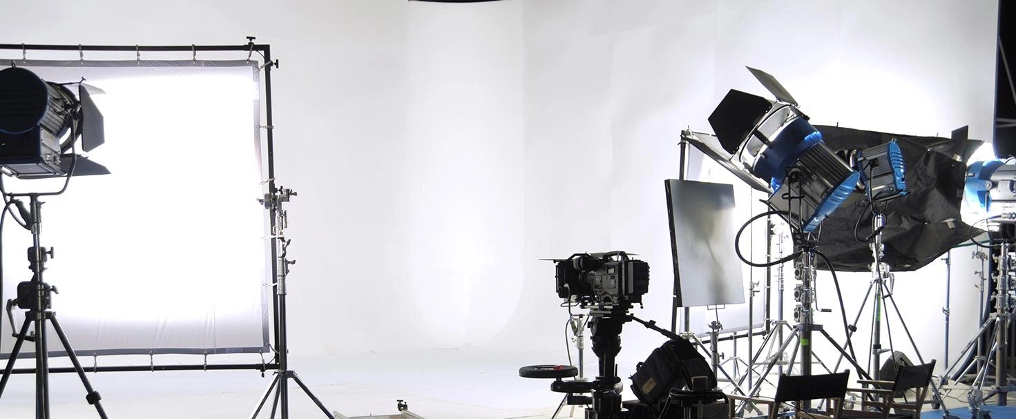 Professional film studio setup with cameras and lights.