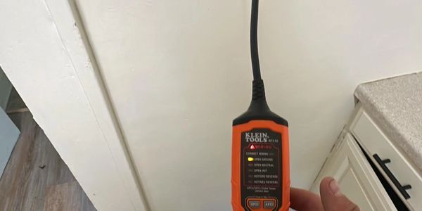 An outlet tester for electricity and proper grounding.