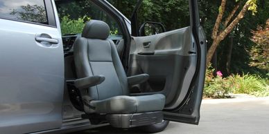 An adaptive seat that is able to turn 90 degrees and lower to the ground for easy transfers.