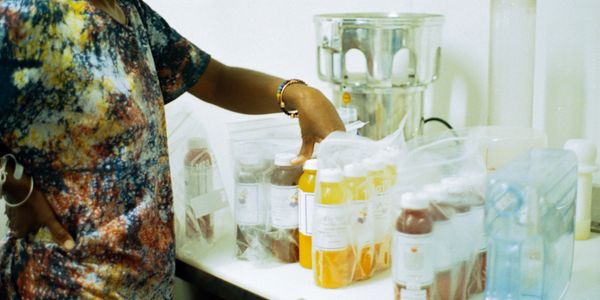 Apryl sorting juices in her kitchen. 