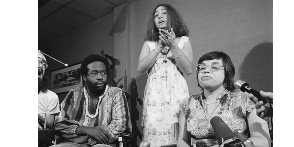 Hale Zukas, Ron Washington, and Judy Heumann; Lynette Taylor provides American Sign Language interpr