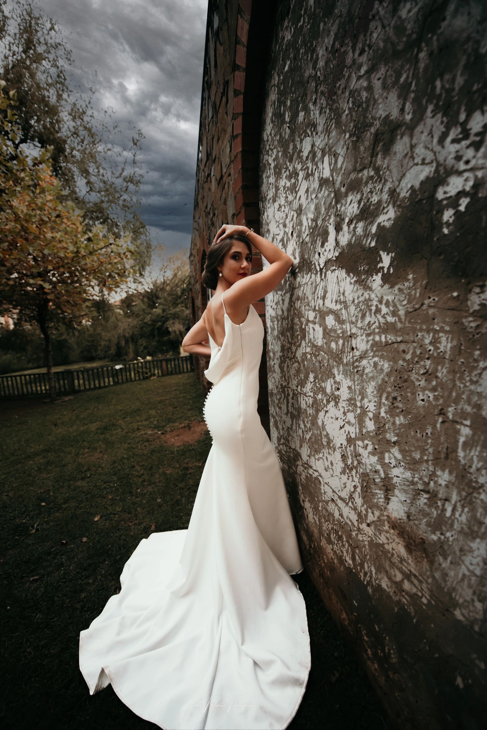Bridal Portrait leaning against a wall at the Social Grill in Pretoria