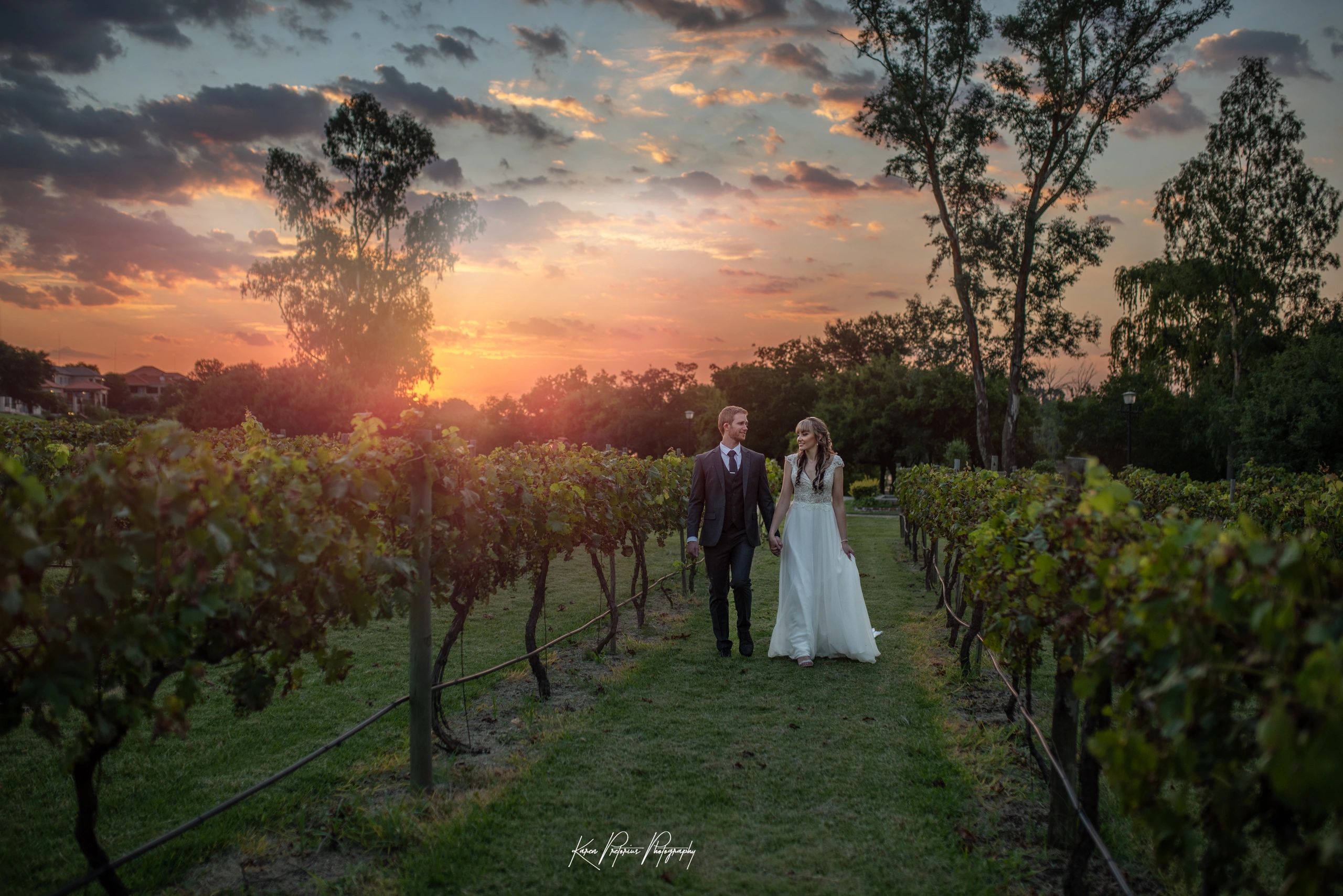 Bride and Groom walking down the winery at Pont de Val Winery