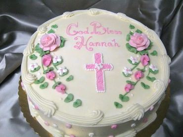 A cream colored cake with God bless Honnah